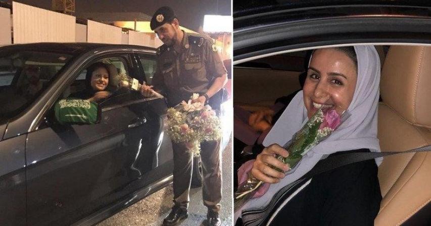Saudi officers hand out roses to women drivers after driving ban lifted