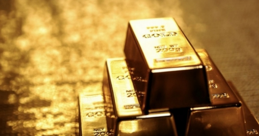 Precious gold rises to over 5-year peak after Federal Reserve hints at rate cuts