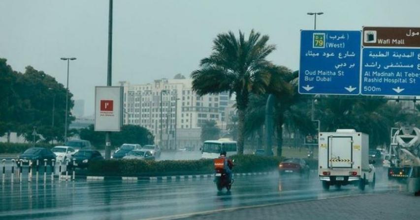 A picture taken from the foot path of heavy rain on Oud Maitha Street.