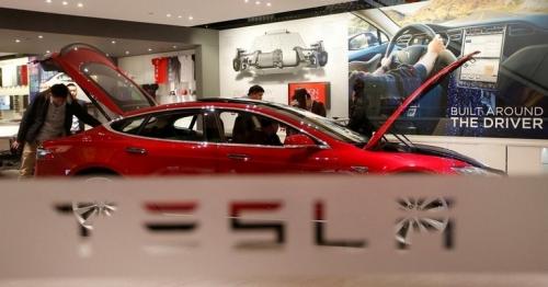 Tesla cuts price of Model 3, lifts prices of premium EVs